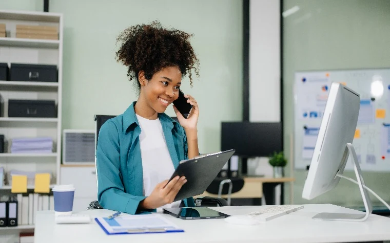 Financial advisor reviewing notes during a client call