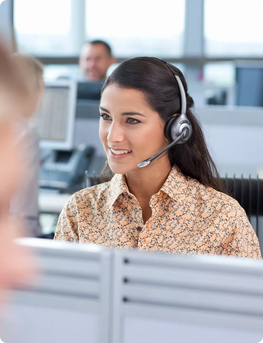 Financial services agent smiling on a call with a headset
