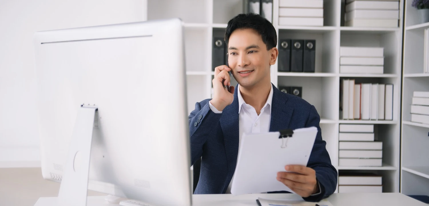 SaaS sales rep reviewing notes during a call
