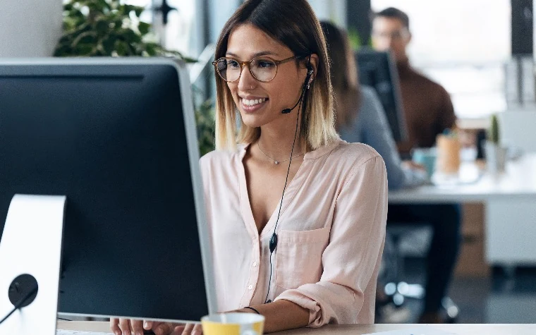 Sales rep practicing a call while wearing a headset