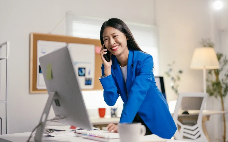 Sales rep smiling on a live customer call