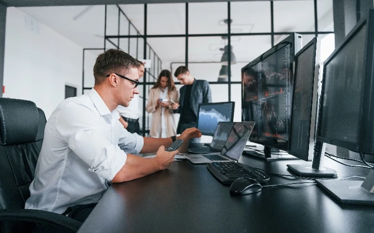 Sales team reviewing performance data in a modern office